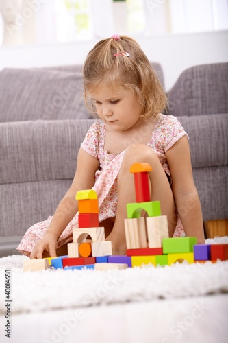 Little girl playing at home