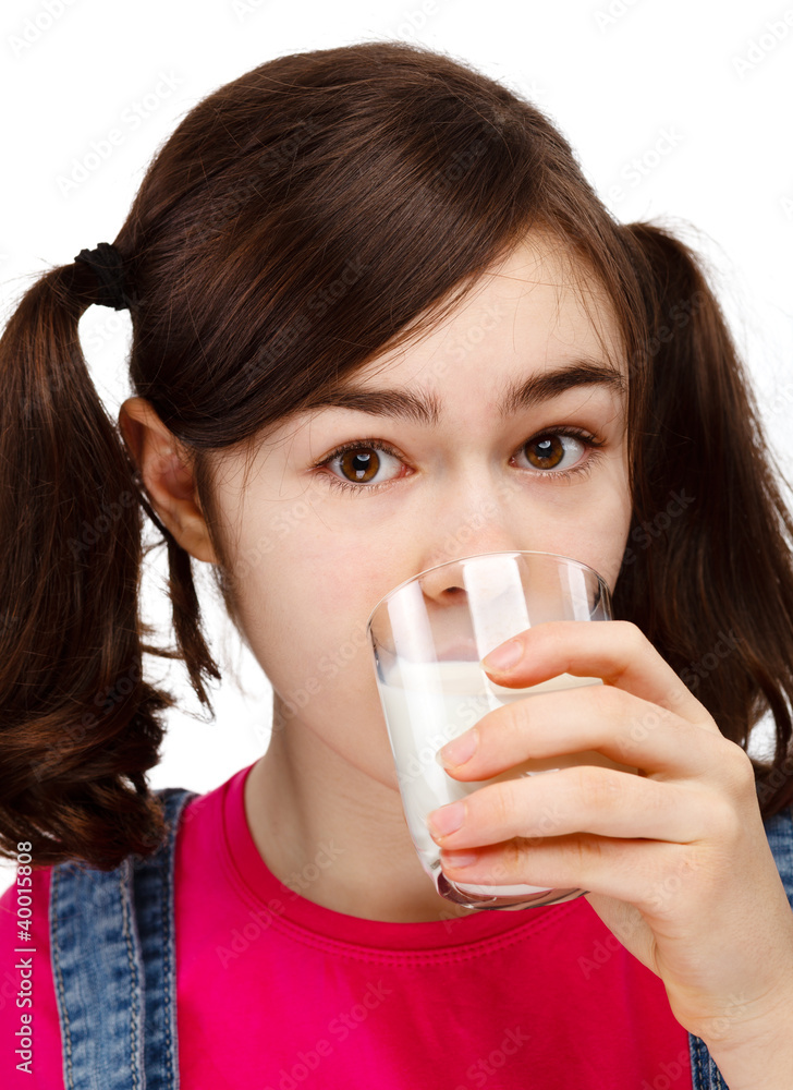 Girl holding glass of milk isolated on white background