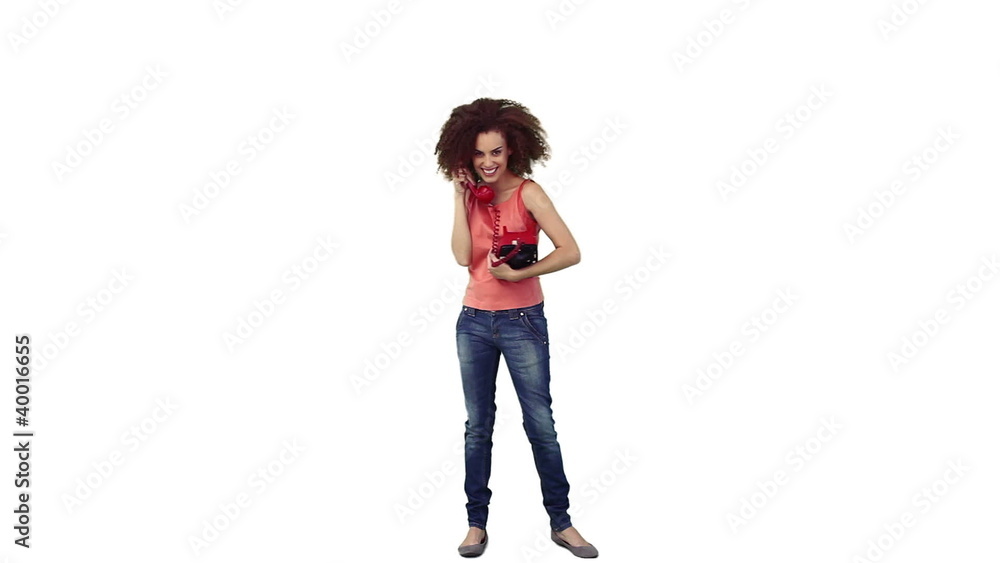 Smiling woman is talking on the telephone Smiling woman is talking on the telephone