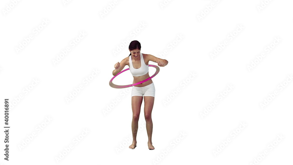 A woman is training with a hula hoop