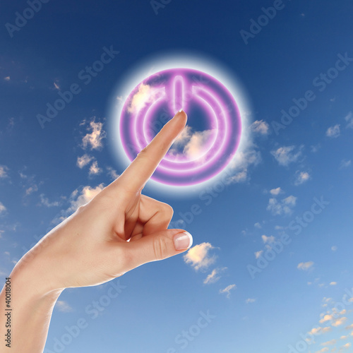 Power button against sky background