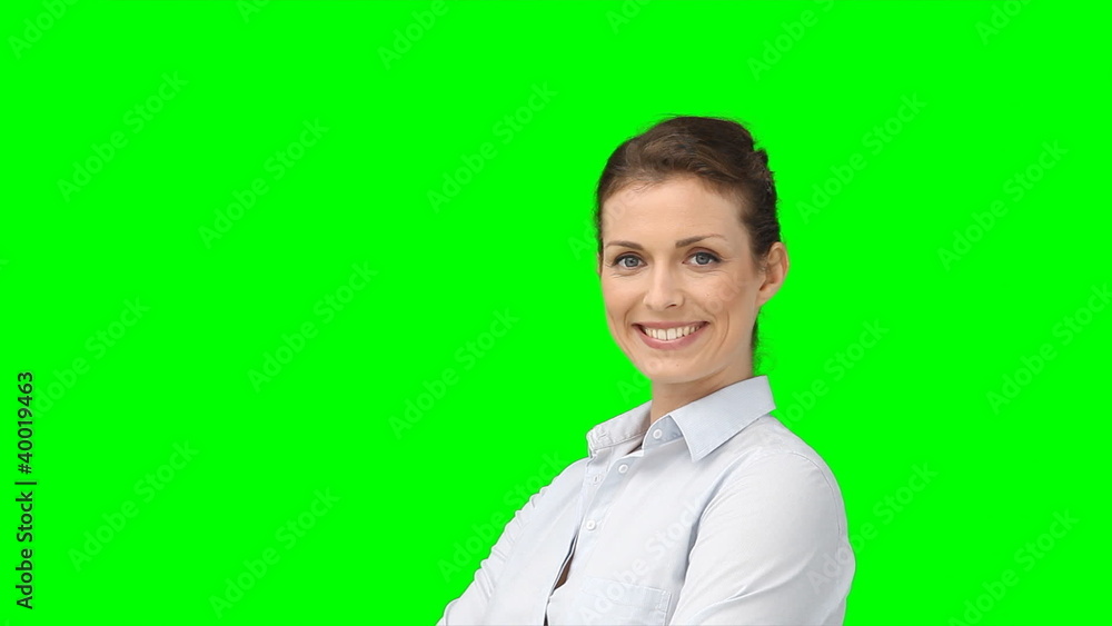 A serious woman turns her head and then smiles A serious woman turns her head and then smiles