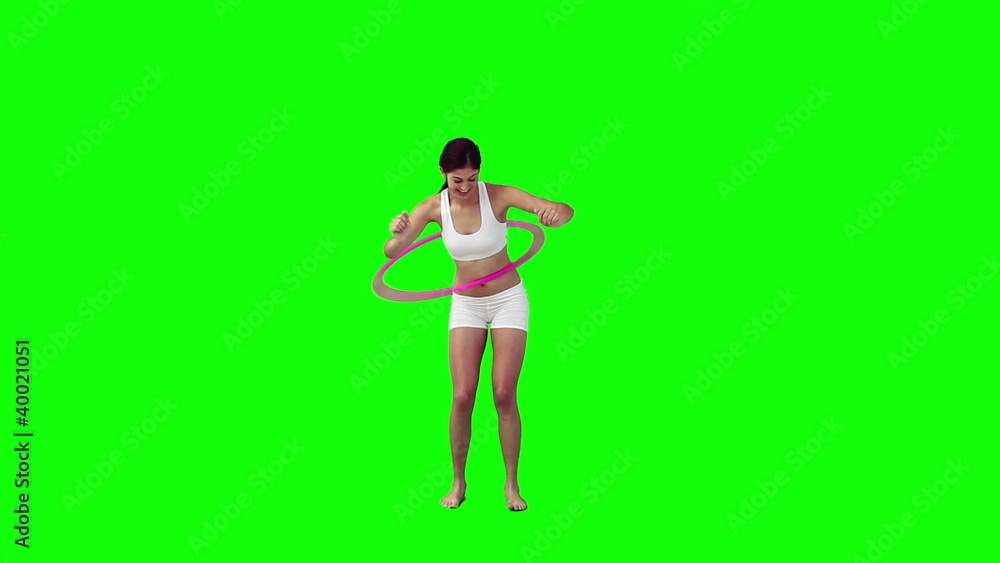 Woman exercises with a hula hoop Woman exercises with a hula hoop