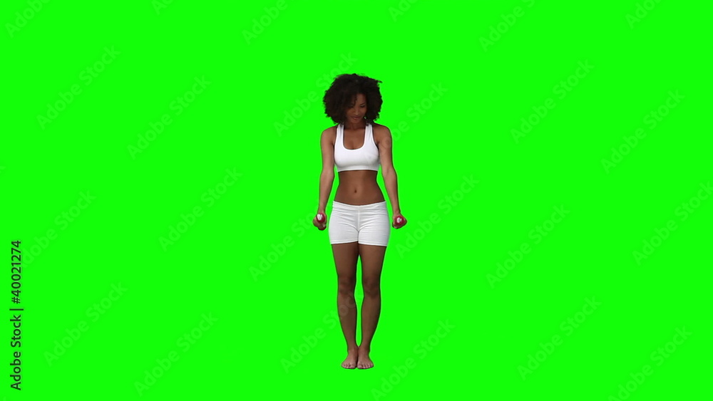 A woman holding weights is exercising A woman holding weights is exercising