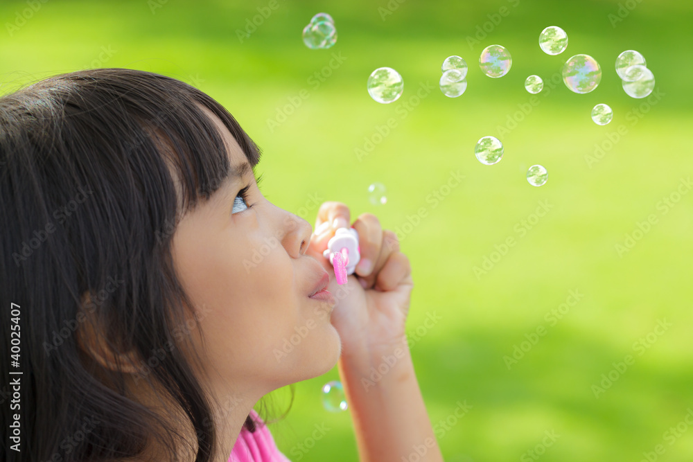 Blowing soap bubbles