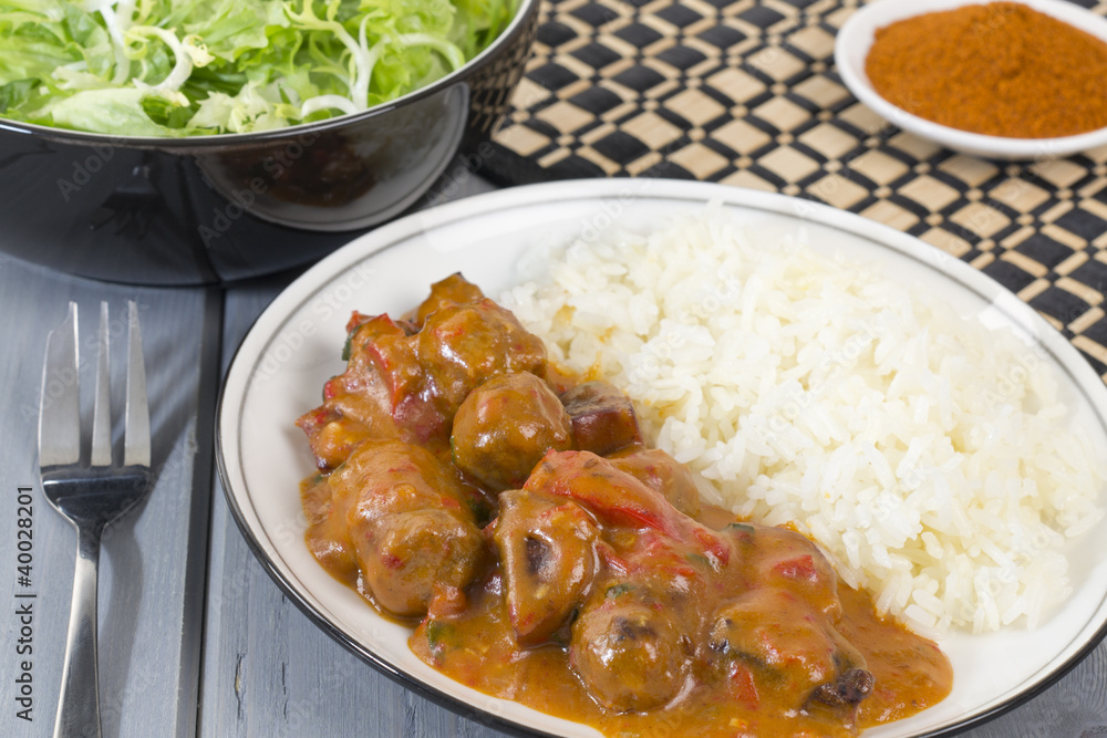 Goulash - Hungarian sausage stew served with white rice & salad Goulash - Hungarian sausage stew served with white rice & salad