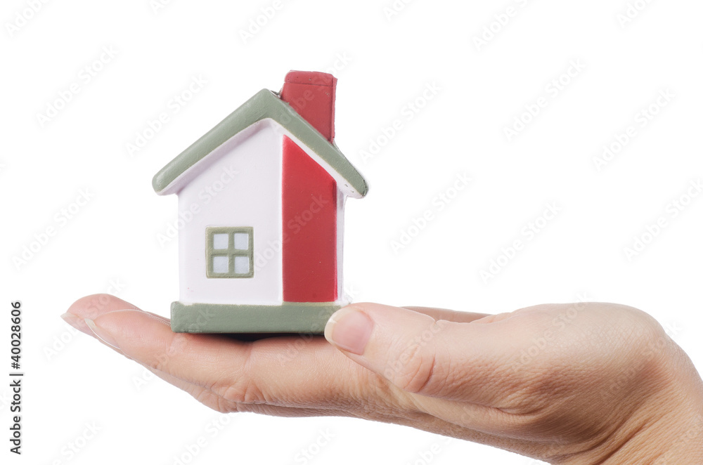 The model house in female hands on white The model house in female hands on white