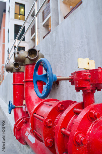 red gas pipe with a blue valve