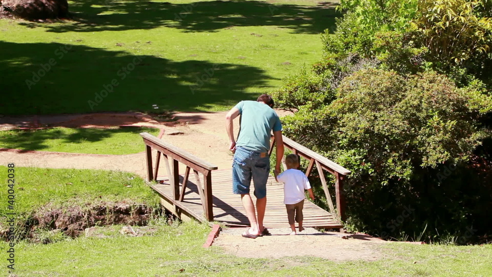Man walking with his little boy Man walking with his little boy