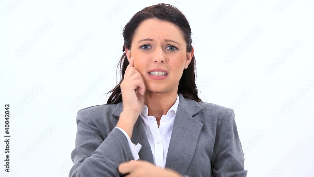 Nervous brunette woman standing upright Nervous brunette woman standing upright