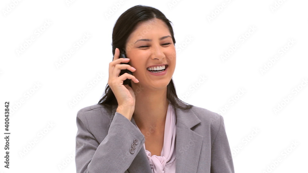 Smiling brunette woman using her cellphone Smiling brunette woman using her cellphone