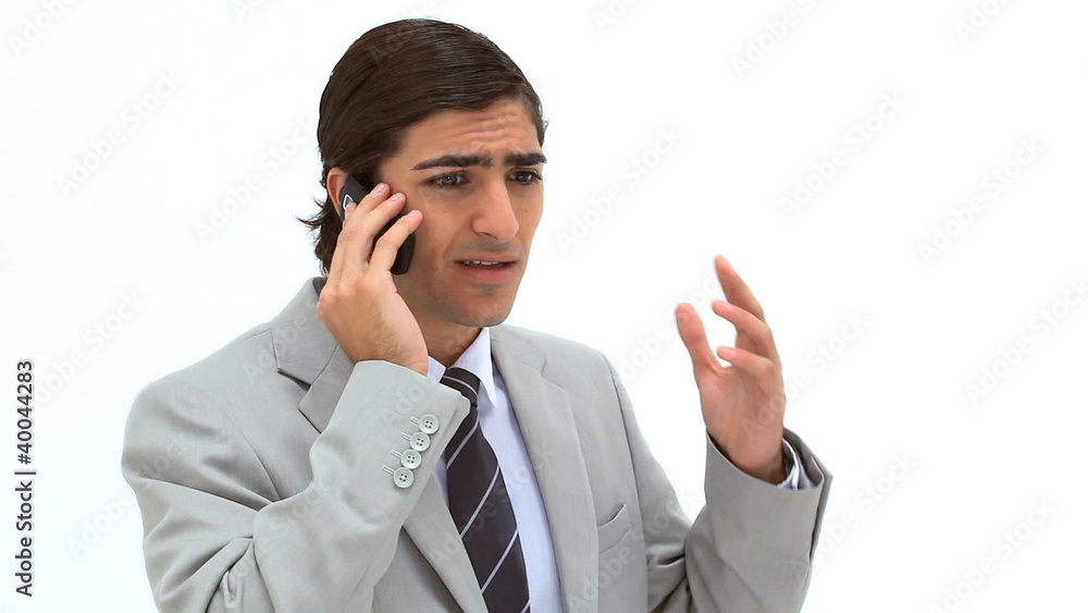 Businessman having a serious talk on the phone Businessman having a serious talk on the phone
