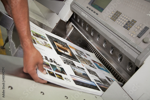 Sheet pulled from printing press photo