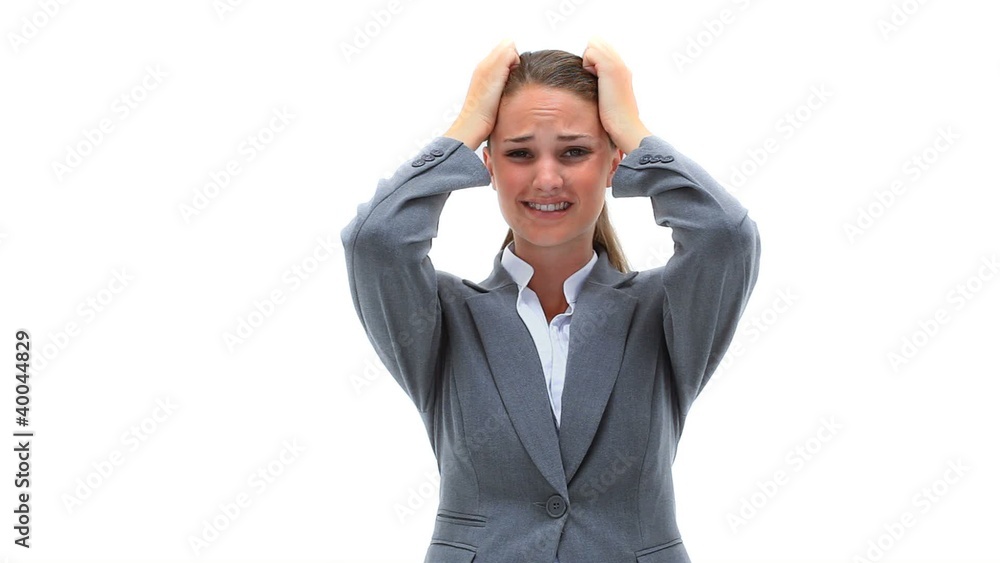 Nervous woman placing her hands on her head Nervous woman placing her hands on her head