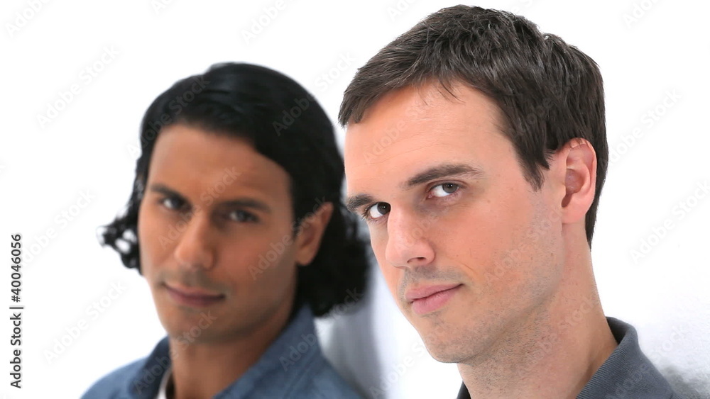 Two men leaning against a wall Two men leaning against a wall