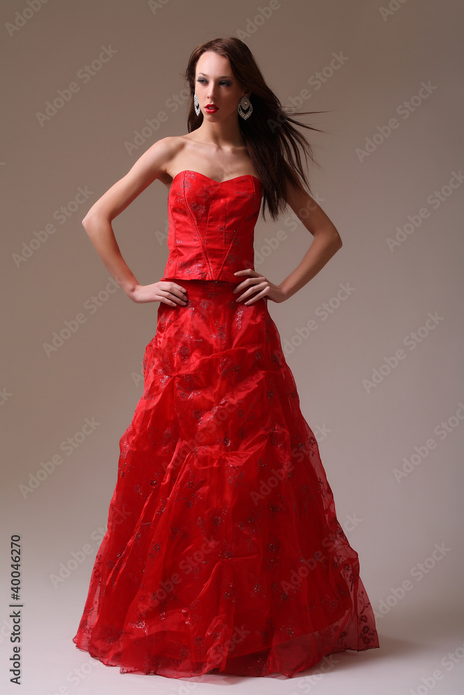 Young fashion model in red dress Young fashion model in red dress