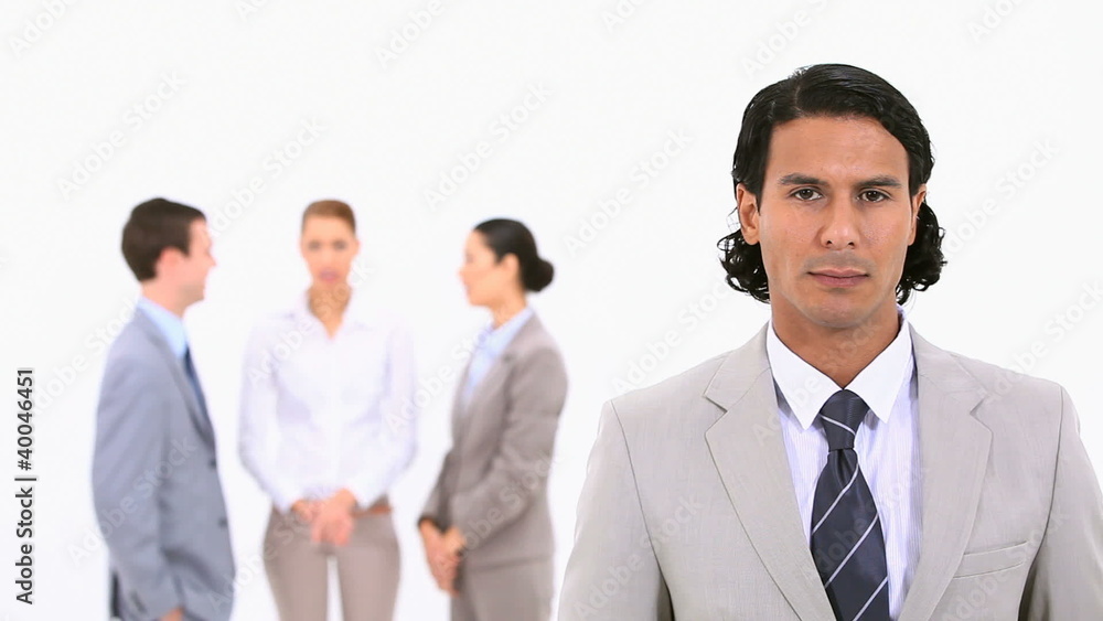 A businessman standing in the foreground A businessman standing in the foreground