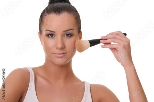 beautiful woman with a brush for powder