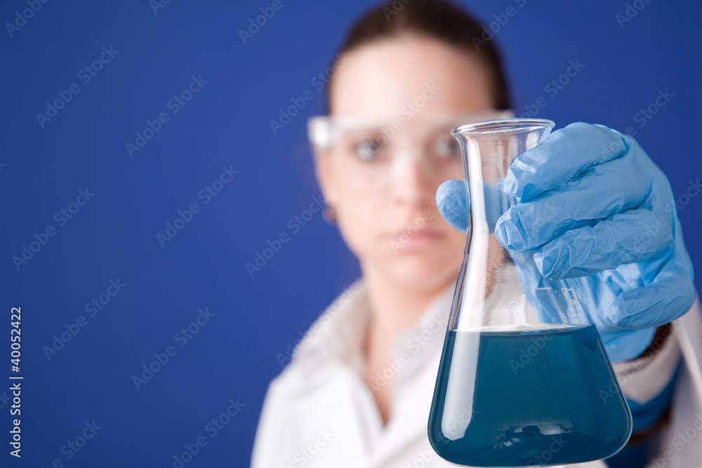 Young scientist against blue background Young scientist against blue background