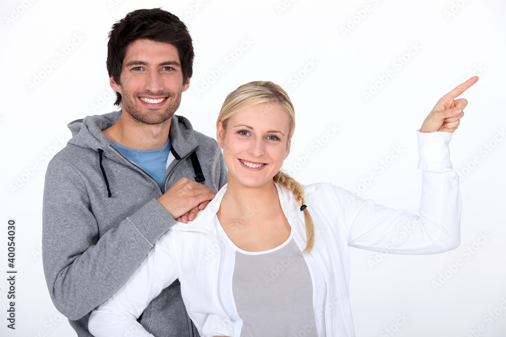 Casual couple pointing Casual couple pointing