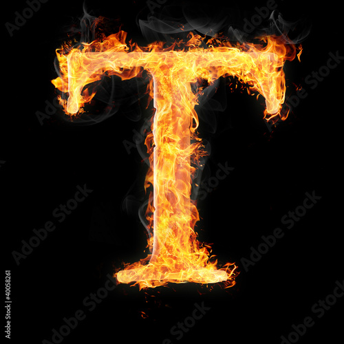 Fonts and symbols in fire on black background - T