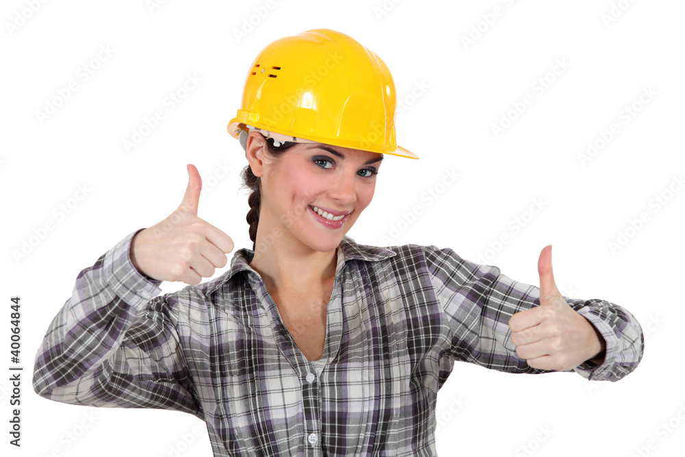Smiling tradeswoman giving two thumb's up