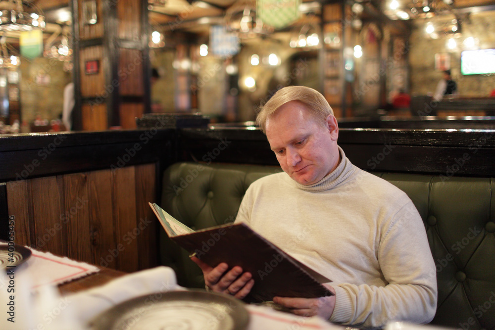 Man reading menu Man reading menu