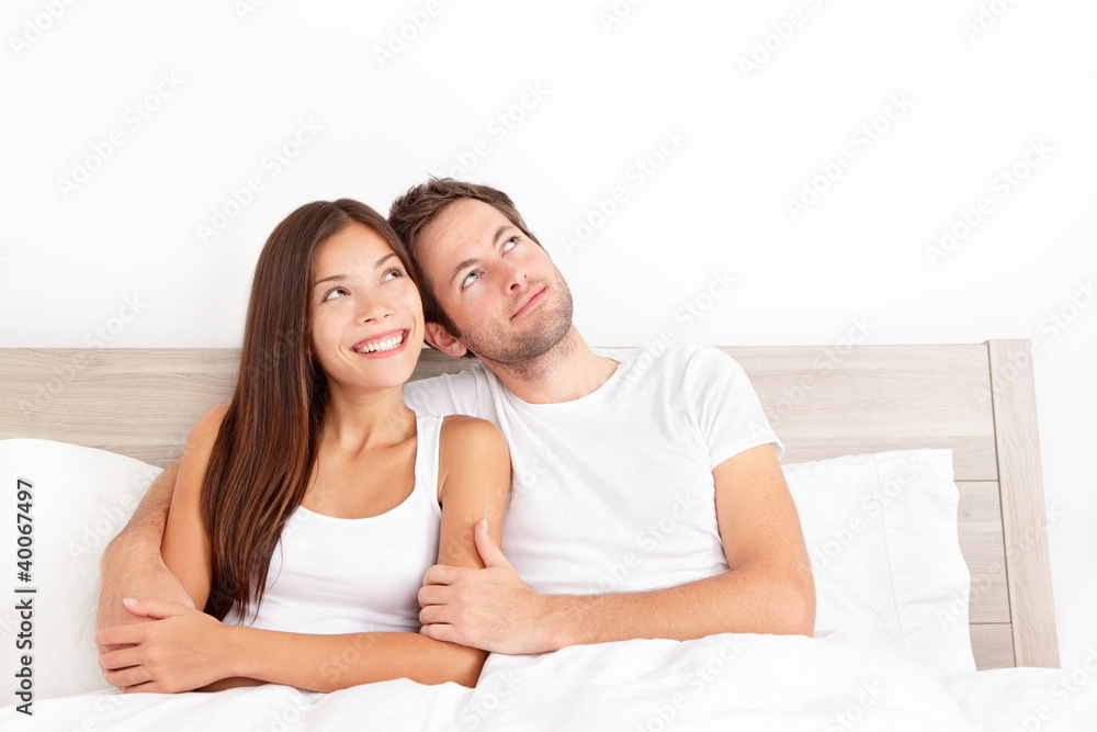 Happy couple in bed