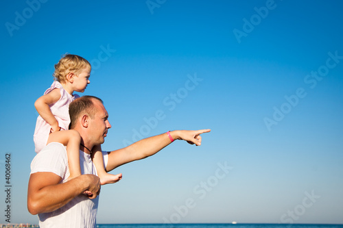 Happy child playing with father