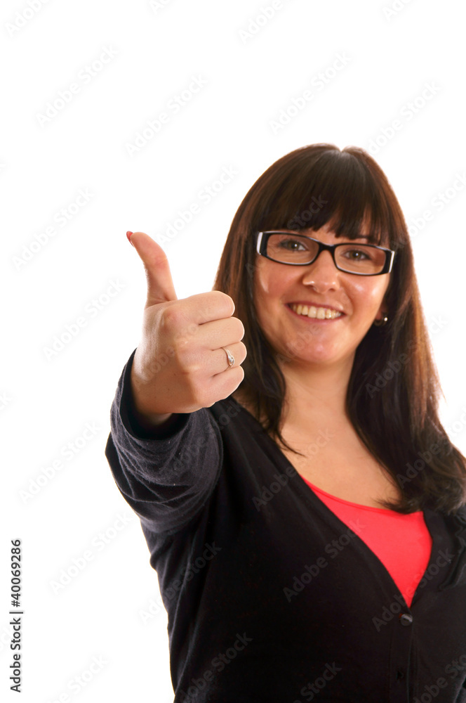 Portrait of a young brunette woman showing thumbs up