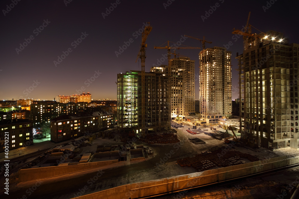 Six high buildings under construction with cranes