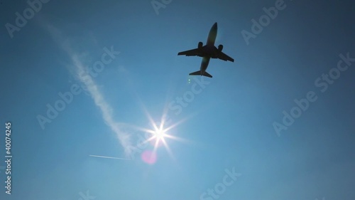 airplane fly over on sunny day