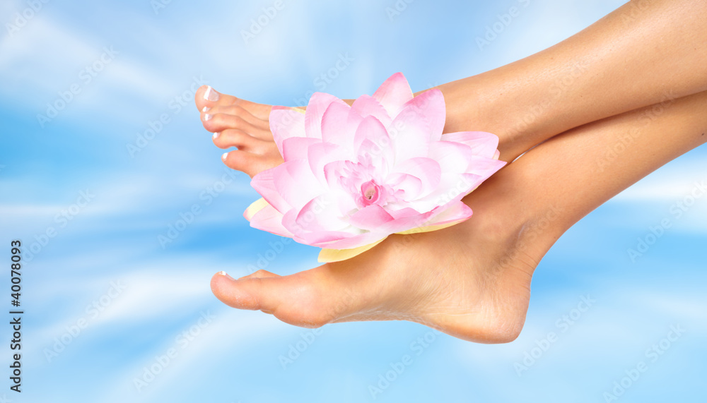 Woman feet with flower. Woman feet with flower.