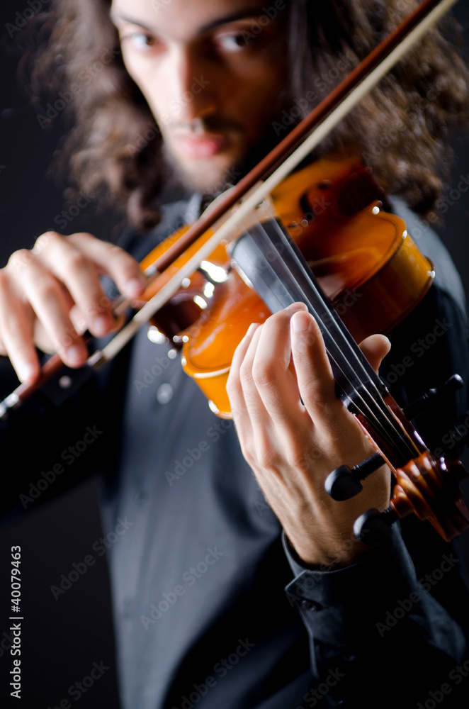 Violin player playing the intstrument Violin player playing the intstrument