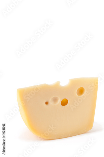 Piece of Maasdam cheese isolated over white