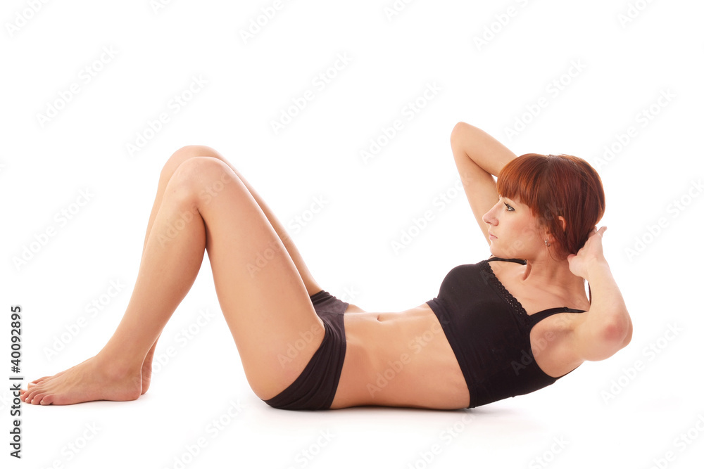 A young attractive female sportsman training, side-view A young attractive female sportsman training, side-view