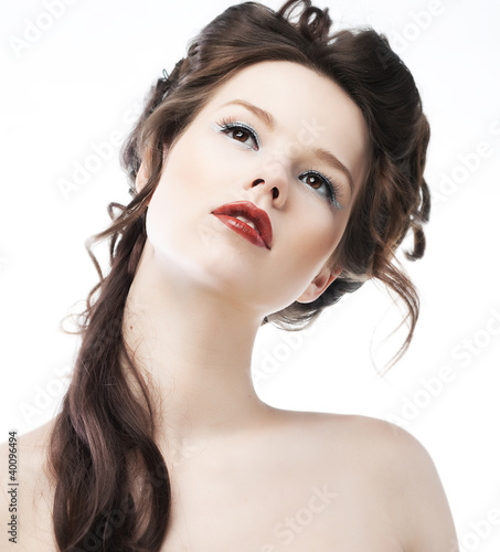 Beauty. Close-up beautiful female face with healthy long hairs.