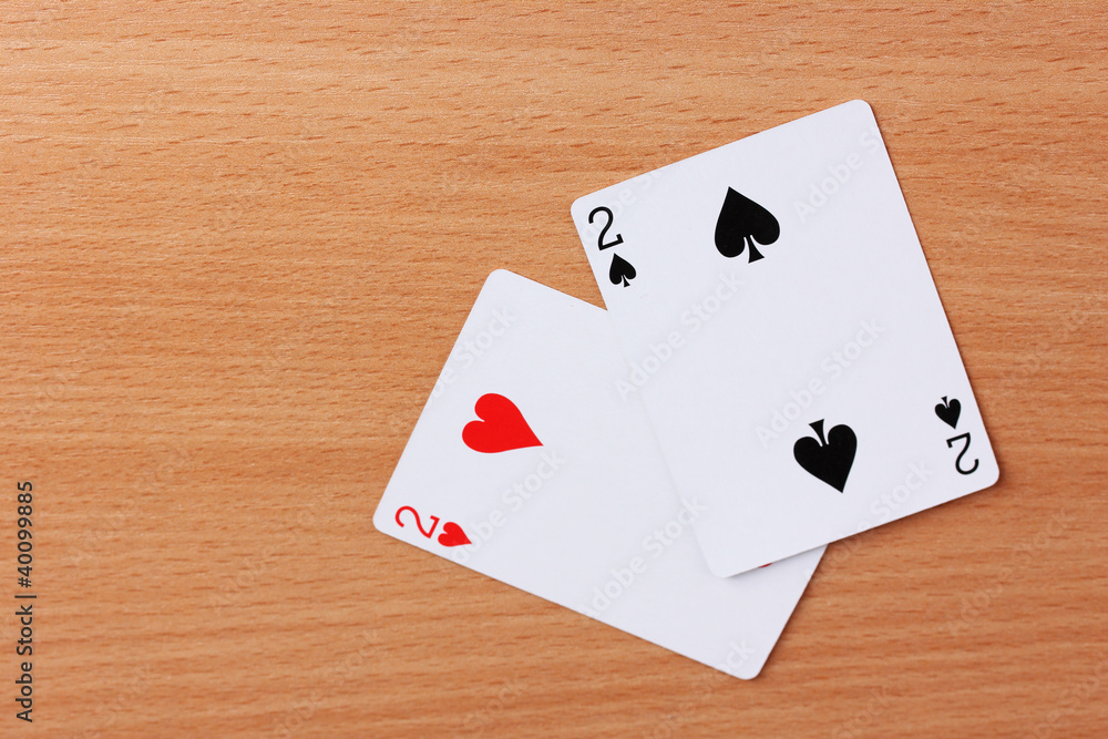 Two cards on wooden background