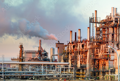 Smoke from the pipes of oil refinery