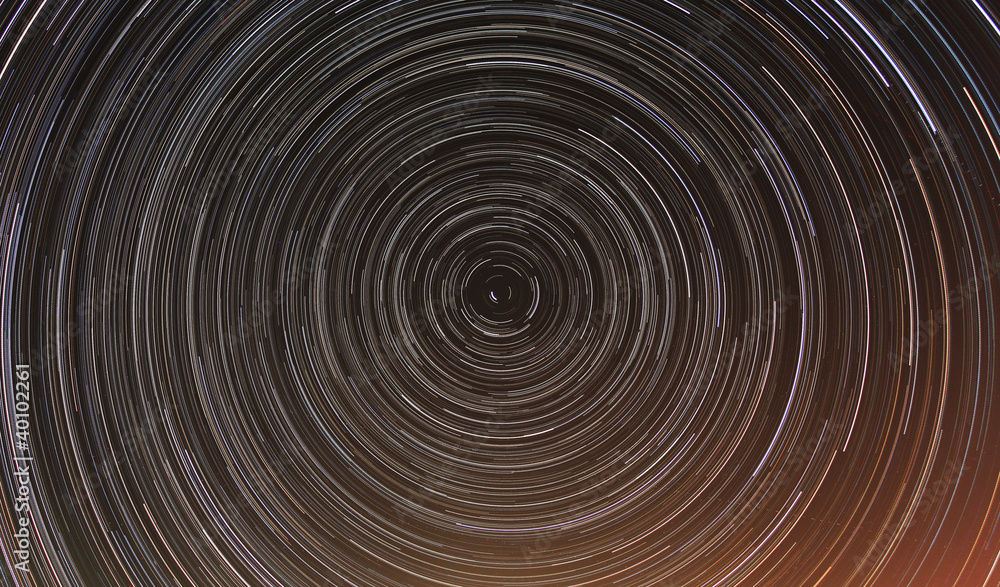 Cumulative time lapse of star trails in night sky. Cumulative time lapse of star trails in night sky.