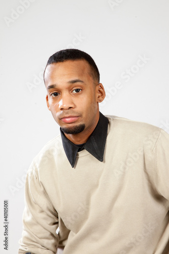 black man looking thoughtfully at the camera
