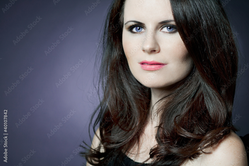 Fototapeta premium Fashion female model with long curly hair.