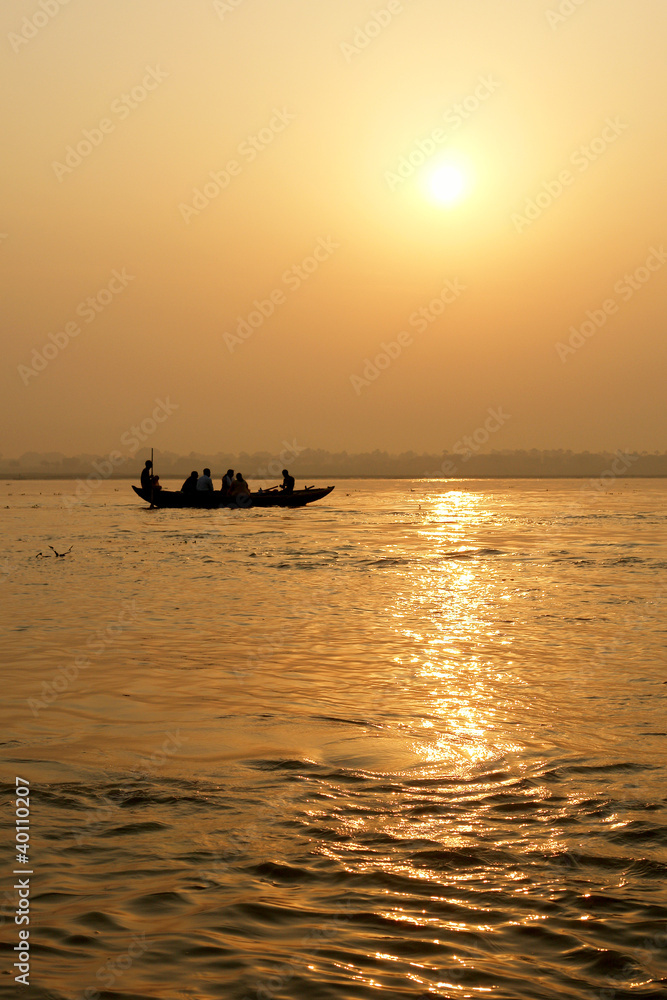 Tradicional boat trip in ganjes river at sunrise
