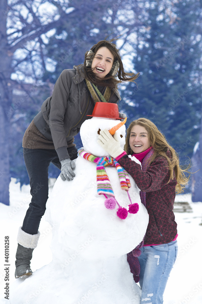 Girls with snowman