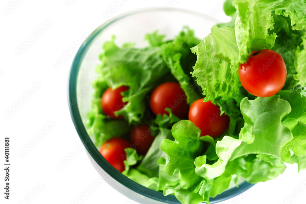 Light lettuce and tomatoes flying salad concept Light lettuce and tomatoes flying salad concept