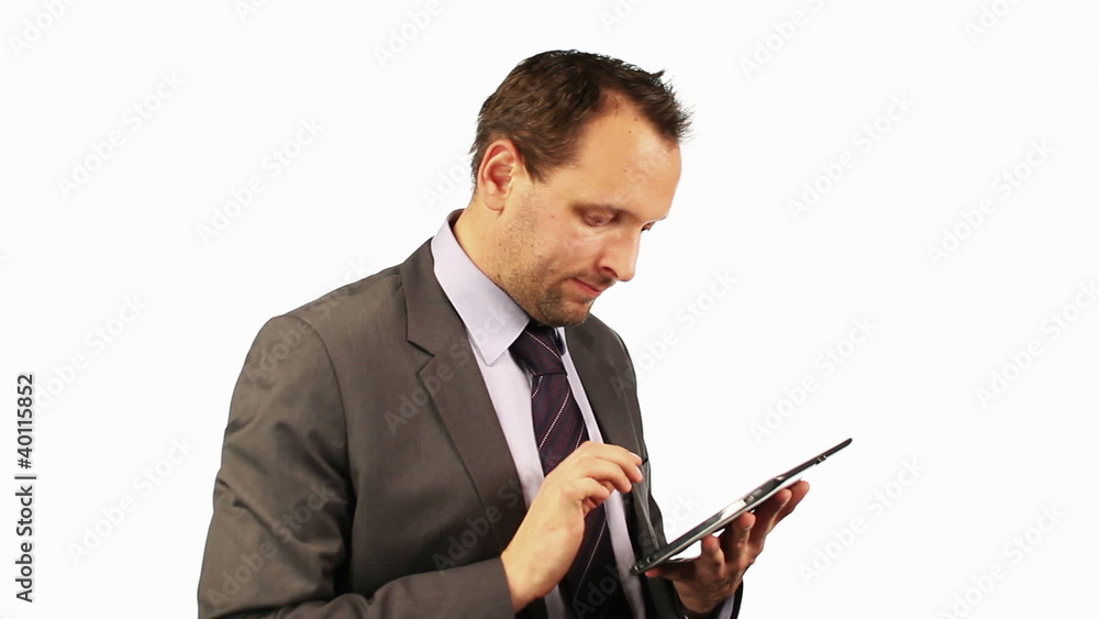 Young businessman with tablet computer, isolated on white Young businessman with tablet computer, isolated on white