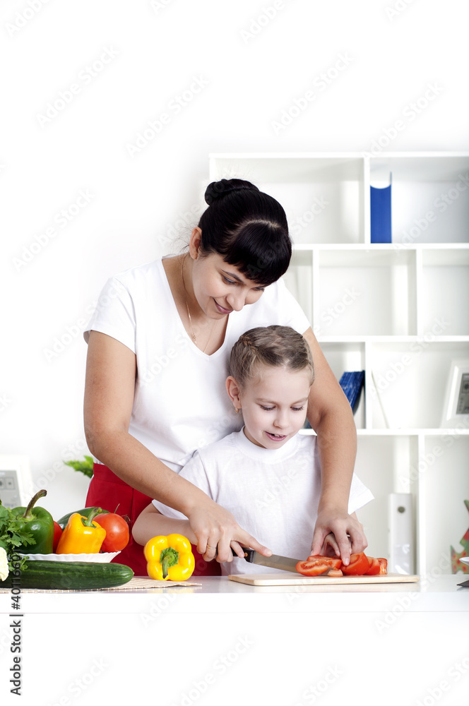 mom and daughter cooking together