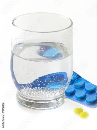 medicines and glass of water for cure