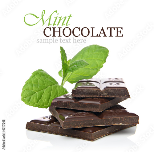 Mint chocolate concept with chocolate pieces and fresh mint photo