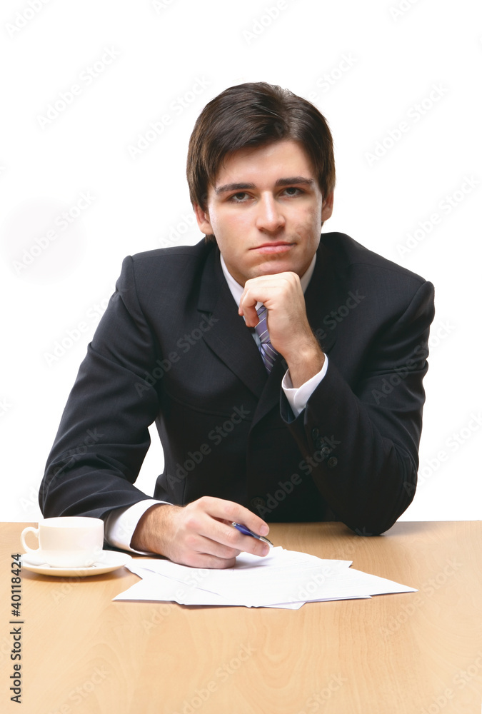 young business man on a desk, isolated on white